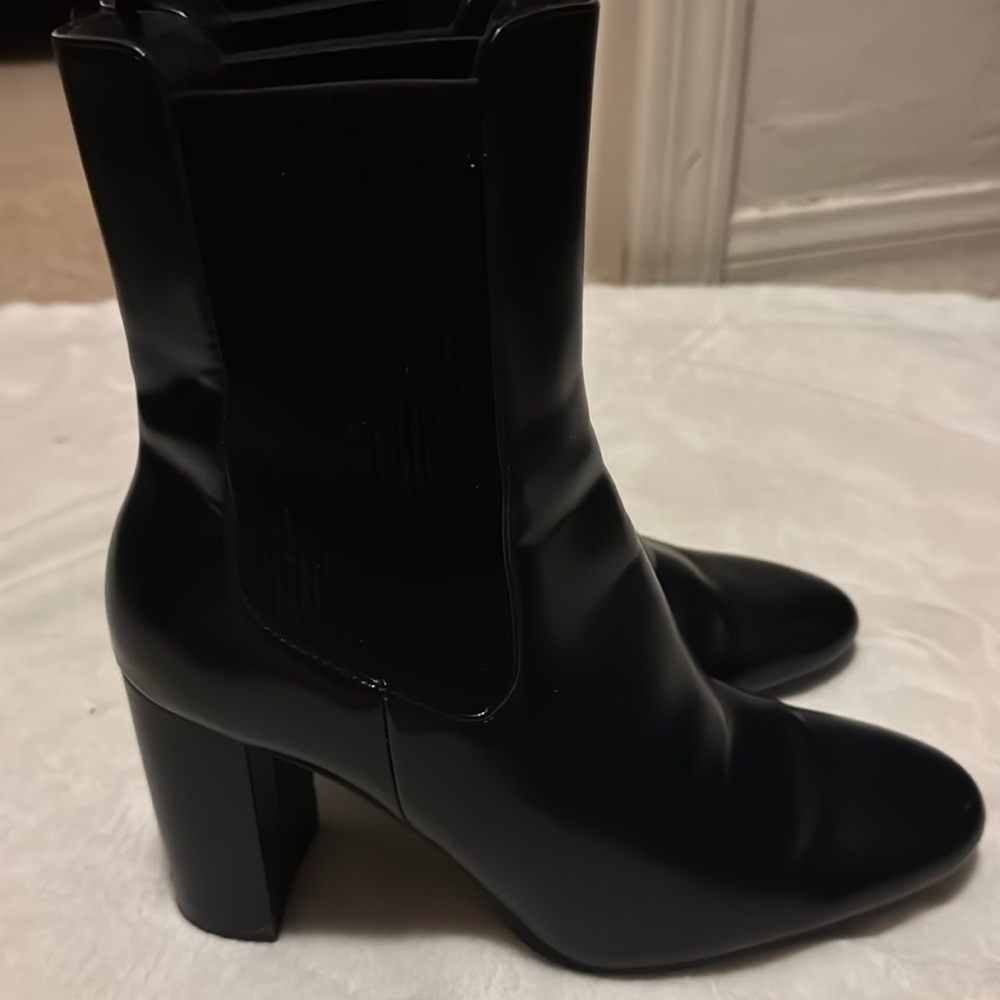 Comfortable black leather booties with chunky heel and stretchy ankle fitting